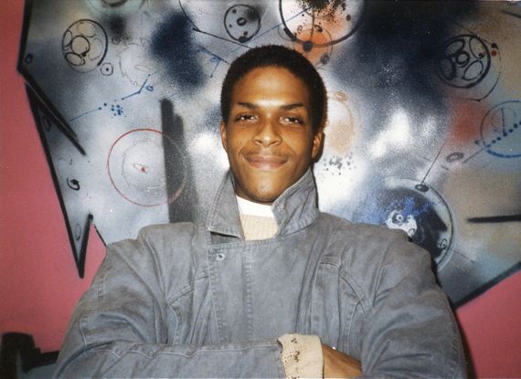 Brooklyn guy in front of mural.  Early 1980s